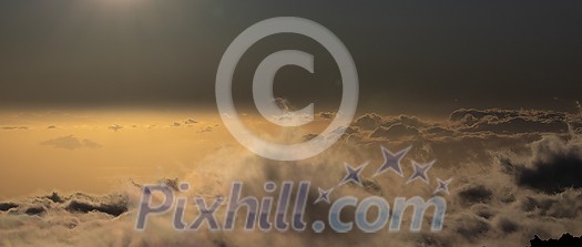 Sky above clouds with sun shining intensely - Earth's atmosphere concept Sky above clouds with sun shining intensely - Earth's atmosphere concept