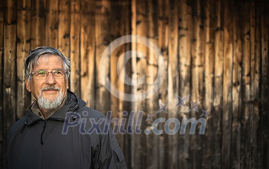 Senior man enjoying the outdoors, hiking, walking throught lovely nature Senior man enjoying the outdoors, hiking, walking throught lovely nature