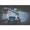 Cars on a highway at sunset (shallow DOF; color toned image)