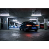 Underground parking. Cars parked in a garage with no people. Many cars in parking garage interior. Underground parking with cars (color toned image)