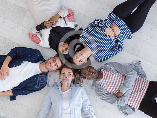 a top view of a diverse group of people lying on the floor and symbolizing togetherness
a top view of a diverse group of people lying on the floor and symbolizing togetherness