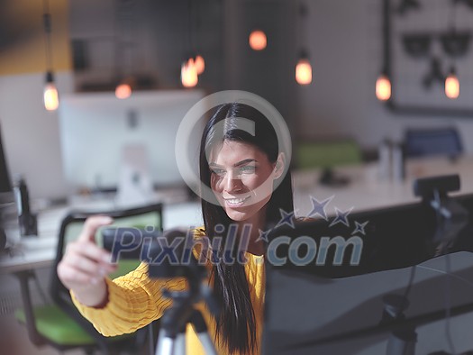 business woman have online meeting in modern open space coworking office as influencer making podcat or tutorial videos business woman have online meeting in modern open space coworking office as influencer making podcat or tutorial videos