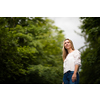Portrait of a relaxed middle aged woman outdoors, looking happy, enjoying the life