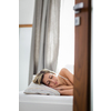 Beautiful young woman sleeping in bed