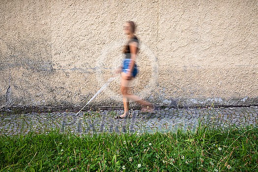 Blind woman walking on city streets, using her white cane to navigate the urban space better and to get to her destination safely Blind woman walking on city streets, using her white cane to navigate the urban space better and to get to her destination safely