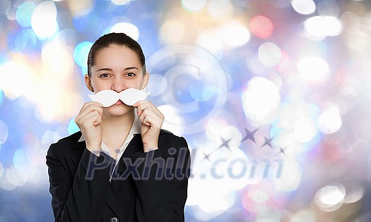 Happy cute girl trying male paper mustache Happy cute girl trying male paper mustache