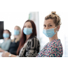 real businesspeople on business meeting in bright office on coronavirus new normal time wearing protective medical face mask and keep distance
