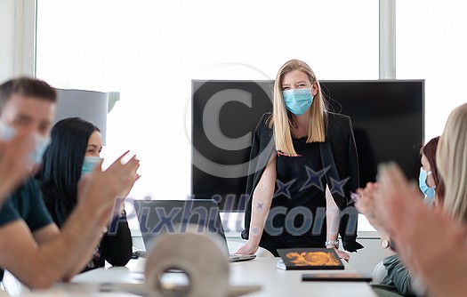real businesspeople on business meeting in bright office on coronavirus new normal time wearing protective medical face mask and keep distance real businesspeople on business meeting in bright office on coronavirus new normal time wearing protective medical face mask and keep distance