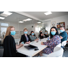 real businesspeople on business meeting in bright office on coronavirus new normal time wearing protective medical face mask and keep distance