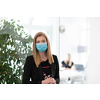 business woman portrait wearing medical mask in bright modern office new normal coronavirus outbreak concept real people