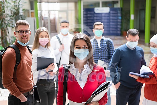 multiethnic students group walking on university coridor wearing protective face mask in new normal coronavirus pandemic lifestyle in education multiethnic students group walking on university coridor wearing protective face mask in new normal coronavirus pandemic lifestyle in education