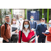 multiethnic students group walking on university coridor wearing protective face mask in new normal coronavirus pandemic lifestyle in education