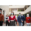 multiethnic students group walking on university coridor wearing protective face mask in new normal coronavirus pandemic lifestyle in education