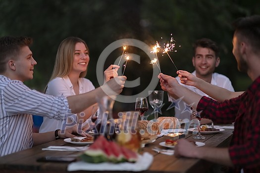 group of happy friends having picnic french dinner party outdoor during summer holiday vacation near the river at beautiful nature group of happy friends having picnic french dinner party outdoor during summer holiday vacation near the river at beautiful nature