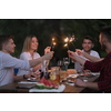 group of happy friends having picnic french dinner party outdoor during summer holiday vacation near the river at beautiful nature