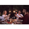 group of happy friends having picnic french dinner party outdoor during summer holiday vacation near the river at beautiful nature