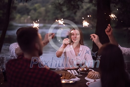 group of happy friends having picnic french dinner party outdoor during summer holiday vacation near the river at beautiful nature group of happy friends having picnic french dinner party outdoor during summer holiday vacation near the river at beautiful nature