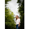 Portrait of a relaxed middle aged woman outdoors, looking happy, enjoying the life