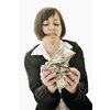 happy young business woman isolated on white playing with dollars money and representing success in finance