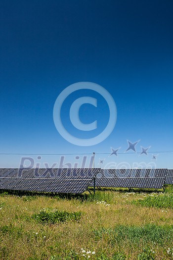 Sunlight as a resource of renewable energy: solar panels on a sunny day Sunlight as a resource of renewable energy: solar panels on a sunny day