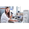 Portrait of a female chemistry student carrying out research in a chemistry lab (color toned image; shallow DOF)