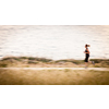 Young woman jogging outdoors (motion blurred image)