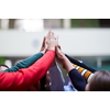 Happy Students Putting their Hands Together in the Air Inside the Classroom.