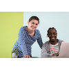 an african american and a young girl plan meetings together and use a laptop for an online meeting
