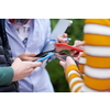 students use smart phones to create a project for the school