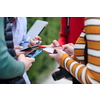 students use smart phones to create a project for the school