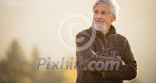 Happy senior man enjoying a lovele autumn day outdoors Happy senior man enjoying a lovele autumn day outdoors
