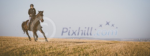 Female horse rider riding outdoors on her lovely horse Female horse rider riding outdoors on her lovely horse