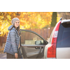 Pretty young woman by her car ready for her daily commute to work