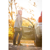 Pretty young woman by her car ready for her daily commute to work