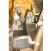 Pretty young woman by her car ready for her daily commute to work