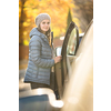 Pretty young woman by her car ready for her daily commute to work