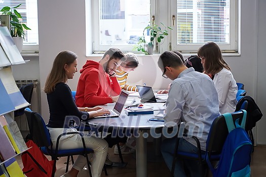 students in a modern environment work together to more easily complete a school project students in a modern environment work together to more easily complete a school project