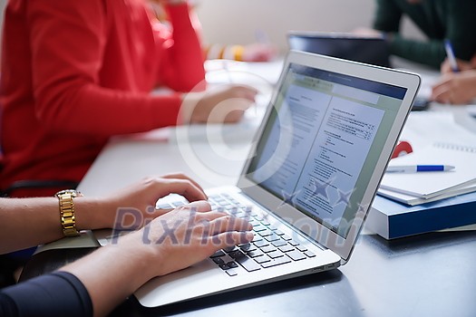 students in a modern environment work together to more easily complete a school project students in a modern environment work together to more easily complete a school project