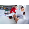 students in a modern environment work together to more easily complete a school project
