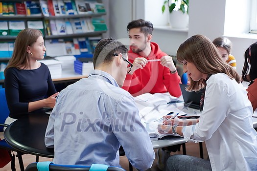students in a modern environment work together to more easily complete a school project students in a modern environment work together to more easily complete a school project