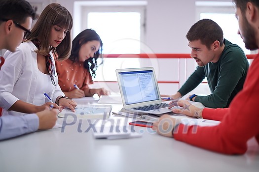 a group of students sit in a library and create a project for a school with the help of modern technology a group of students sit in a library and create a project for a school with the help of modern technology