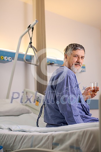 Senior male patient in a modern hospital (shallow DOF; color toned image) Senior male patient in a modern hospital (shallow DOF; color toned image)