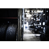 Tyre change - wheel balancing or repair and change car tire at auto service garage or workshop by mechanic