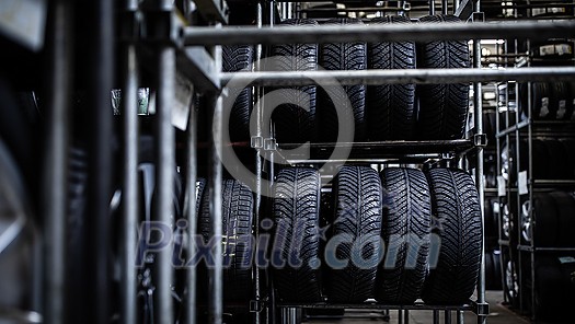 Tyre change - wheel balancing or repair and change car tire at auto service garage or workshop by mechanic Tyre change - wheel balancing or repair and change car tire at auto service garage or workshop by mechanic