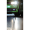 Car in a garage for maintenance, oil, tyre change (shallow DOF; color toned image)