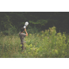Wildlife photographer shooting with his fast aperture telephoto lens photos of birds and mammals in a nature reserve