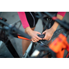 Pretty, young woman biking on a mountain bike enjoying healthy active lifestyle outdoors in summer (shallow DOF)