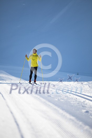 Cross-country skiing: young man cross-country skiing on a winter day Cross-country skiing: young man cross-country skiing on a winter day