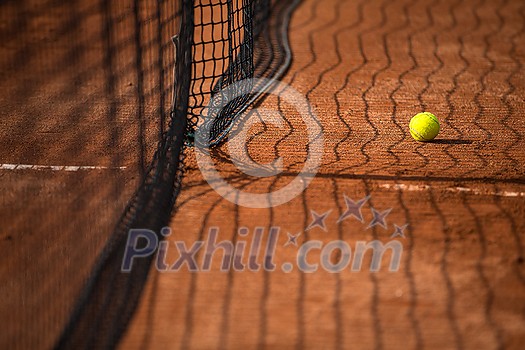 Tennis court with tennis balls and the net Tennis court with tennis balls and the net
