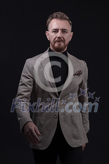 Confident businessman walking forward wearing a causal suit, handsome senior business man hero shot portrait isolated on black. High quality photo Confident businessman walking forward wearing a causal suit, handsome senior business man hero shot portrait isolated on black. High quality photo